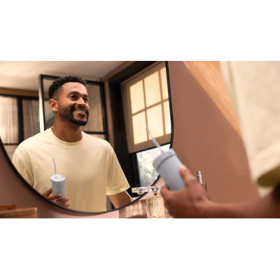 Іригатор Philips портативний Sonicare Compact Flosser 1000, чаша 200 мл, складний, голубий