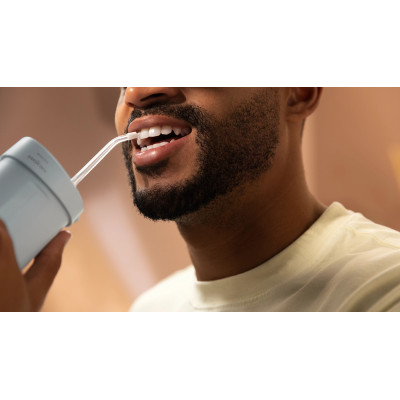 Іригатор Philips портативний Sonicare Compact Flosser 1000, чаша 200 мл, складний, голубий