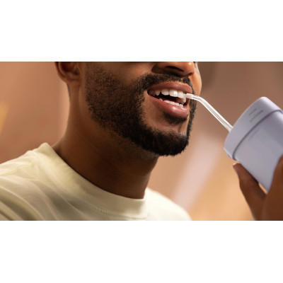 Іригатор Philips портативний Sonicare Compact Flosser 1000, чаша 200 мл, складний, фіолетовий